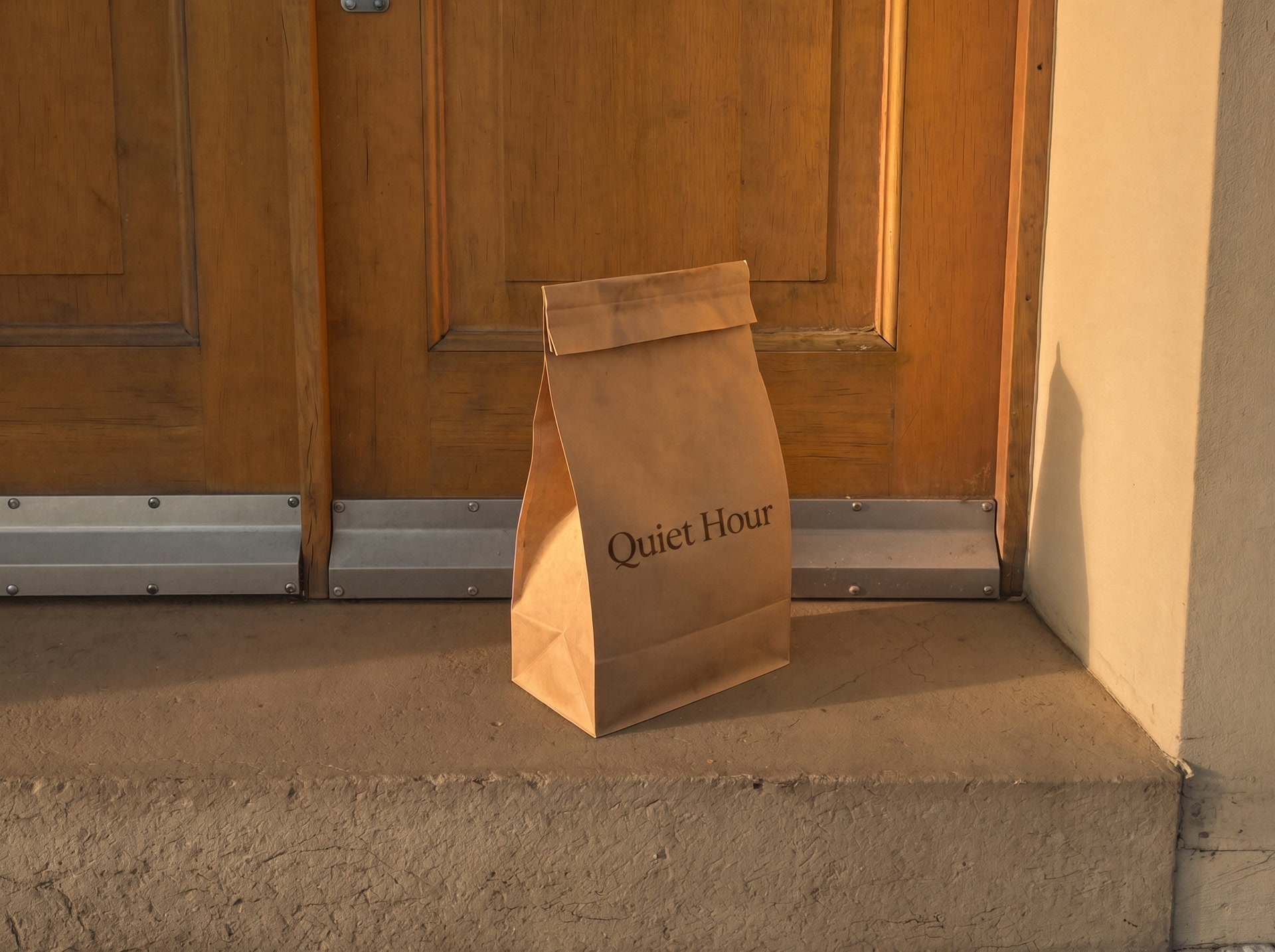 A coffee bag on a doorstep in morning light