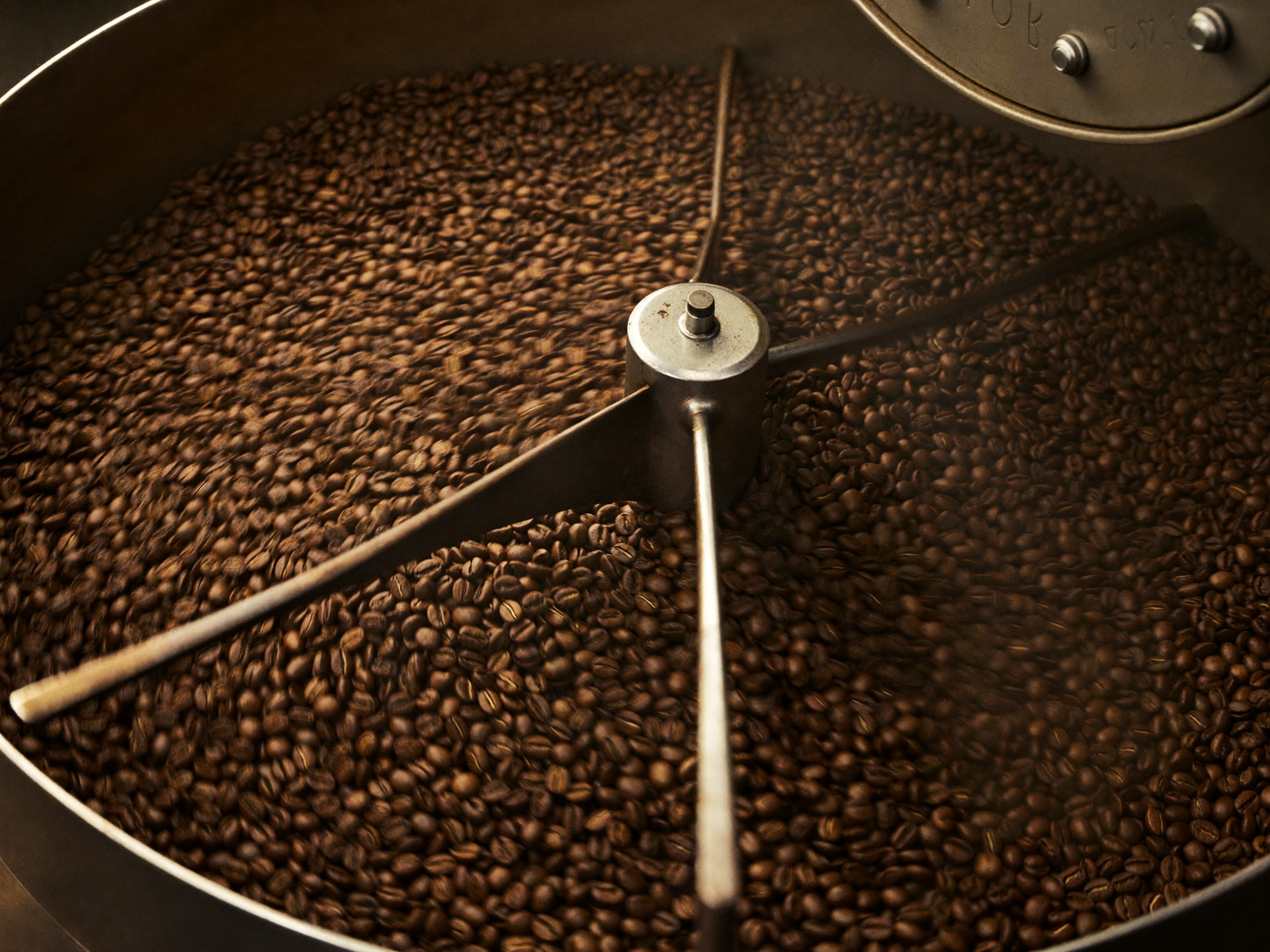 Coffee beans turning in a small-batch roaster